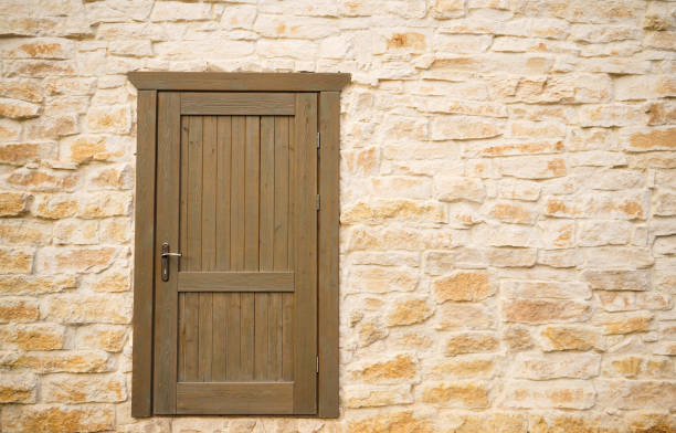 Old brick wall and door texture background, copy space