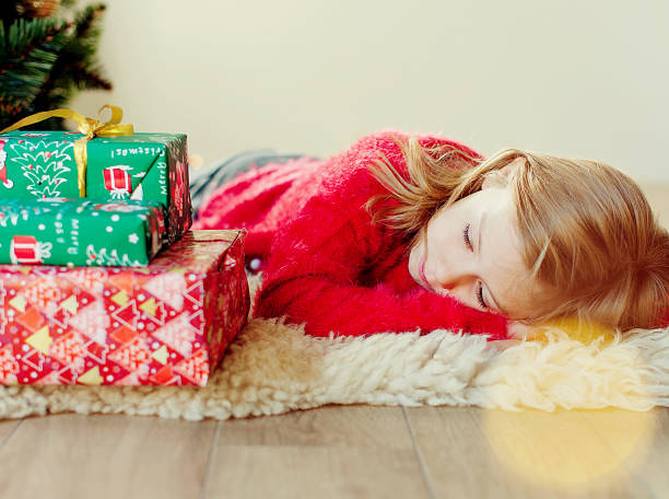 istock Cheerful girl holding Christmas present 1686781622