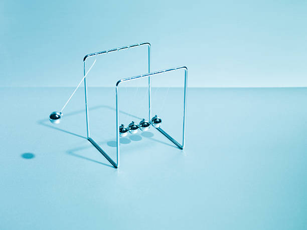 Newtons cradle swinging  perpetual motion stock pictures, royalty-free photos & images