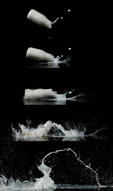 istock Bottle of Milk Falling and Exploging against Black Background 1686801453