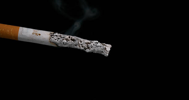 istock Cigarette that Consumes on Black Background 1686812705