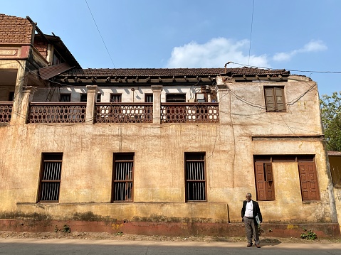 Mangalore, India - January 17 2023: An old heritage building with tall windows in the city of Mangaluru.