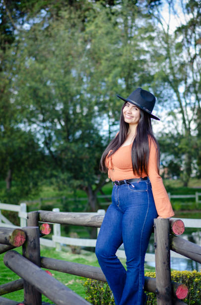 istock beautiful young woman posing outside 1686872350