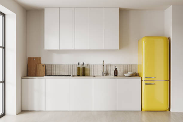 istock Cozy home kitchen interior with fridge and cooking area with kitchenware 1686879154