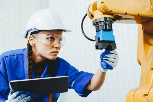 istock female automation machine engineer student study and inspection control robot arm machine in university or factory workshop. AI robot technology new innovation trend for manufacturing in industry 5.0 1686882889
