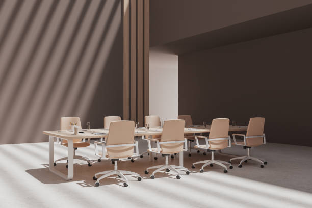 istock Brown meeting room interior with table and armchairs in row 1686885087