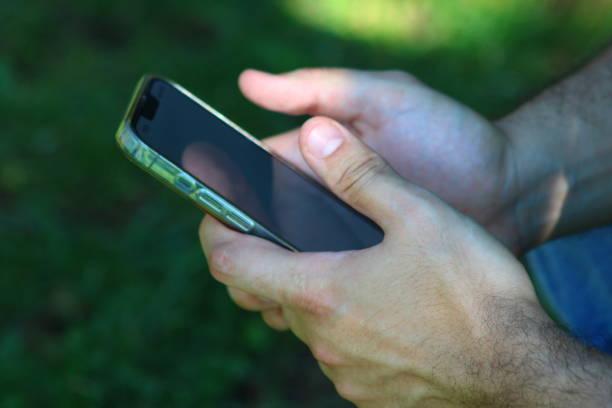 istock A male hand dealing with a smartphone 1686937329