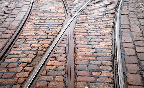 istock Street railway point on granite cobblestone road 168694370