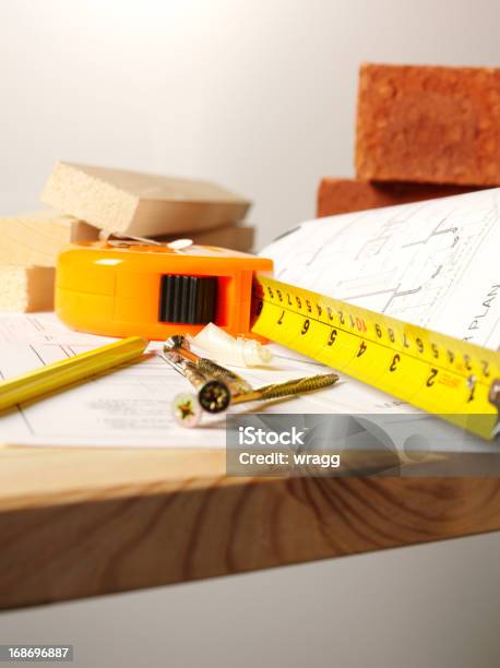 Construction On A Timber Work Bench Stock Photo - Download Image Now - Bench, Blueprint, Brick