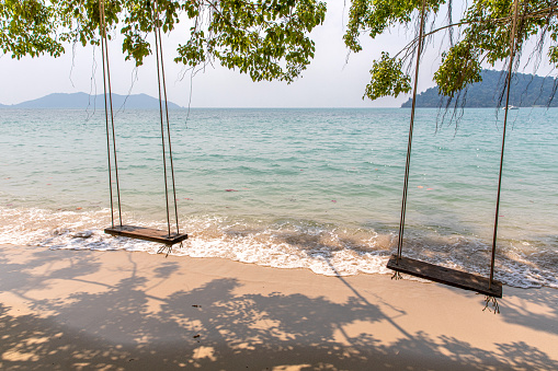 Swing and Tropical beautiful beach, Bang Bao Beach, Koh Chang island, Thailand.
