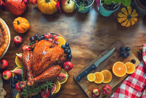 istock Preparing stuffed turkey with side dishes for Thanksgiving celebration 1686998339
