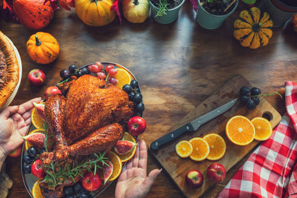 istock Preparing Stuffed Turkey with Side Dishes for Holidays 1686998343
