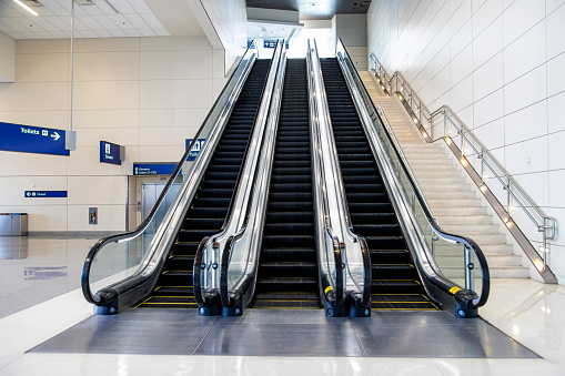 Three large escalators with no people on them
