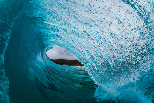 istock Looking inside out of a perfect blue barreling ocean wave 1686999160