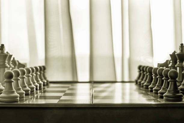 istock Chessboard next to the wide window with figures ready to play 1687028745