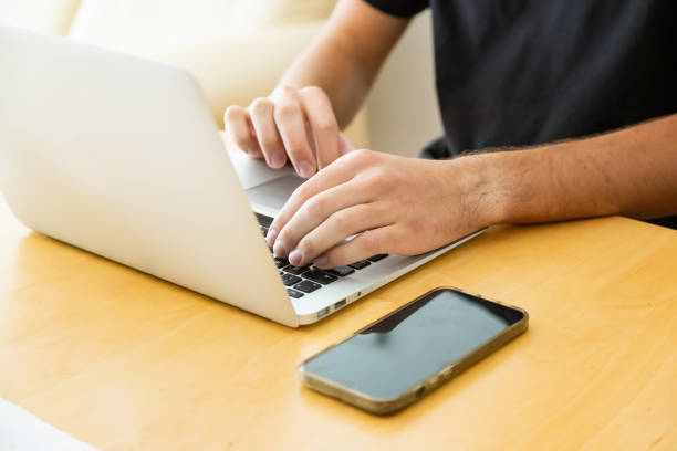 istock 20 years old man working from home 1687031963