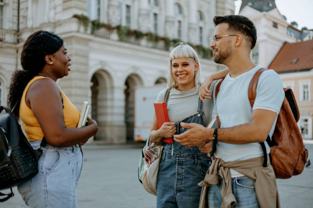 istock A group of students cheerfully talking 1687033550