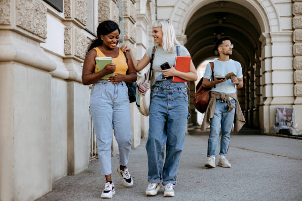 istock Two college female friends having a cheerful conversation 1687035035