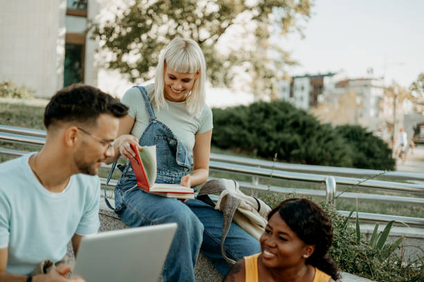 istock A multiracial group of college students cheerfully studying together 1687037307