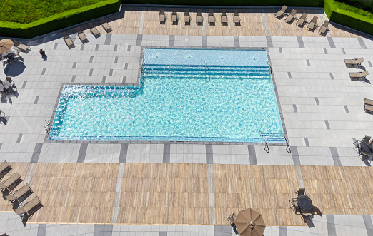 Looking down on a large, chic pool from a high point of view