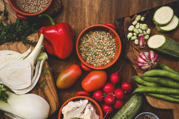 istock fresh organic vegetables on rustic wooden table. 1687095858