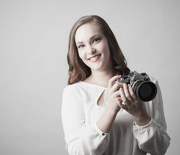istock Woman holding antique camera. 168710314
