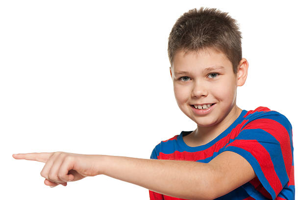 istock Young boy shows her finger to the side 168710747