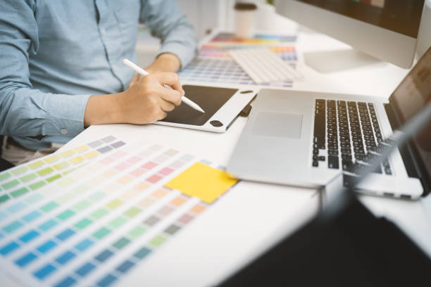 istock Creative graphic designer team working with colour swatch sample, Brainstorming ideas in studio. 1687112111