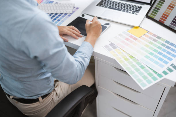 istock Creative graphic designer team working with colour swatch sample, Brainstorming ideas in studio. 1687112133