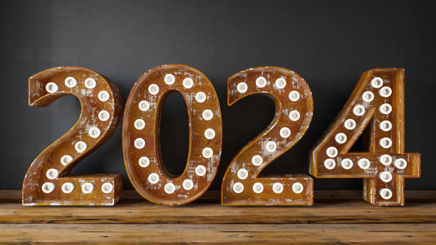 istock 2024 Light Bulb Sign Against Black Wall 1687113740