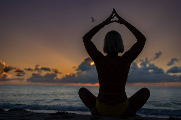 istock Sunrise yoga at the beach 1687114492
