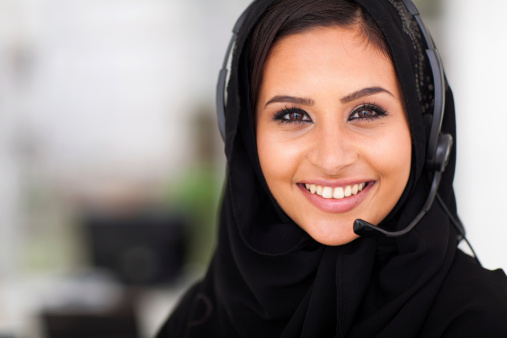 beautiful middle eastern businesswoman with headphones closeup head shot