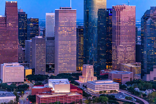 The skyline of Houston, Texas illuminated at night shortly after the sunset shot via helicopter from an altitude of about 800 feet.