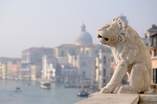 Sixteenth-Century stone lion ornament on a balcony overlooking the Grand Canal, Venice. Statue is over 300 years old.