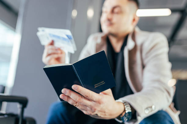 istock Canadian Man Holding His Passport 1687135532