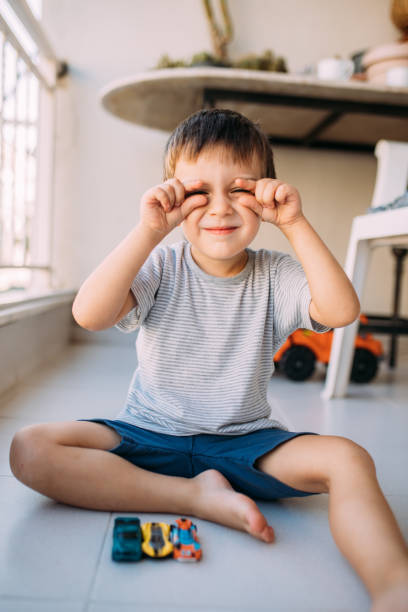 istock Little boy playing with toy car at balcony 1687150766
