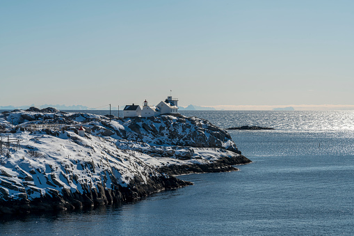 Small fishing village Henningsvær in the Lofoten Island. Small white church on the end of archipelago.