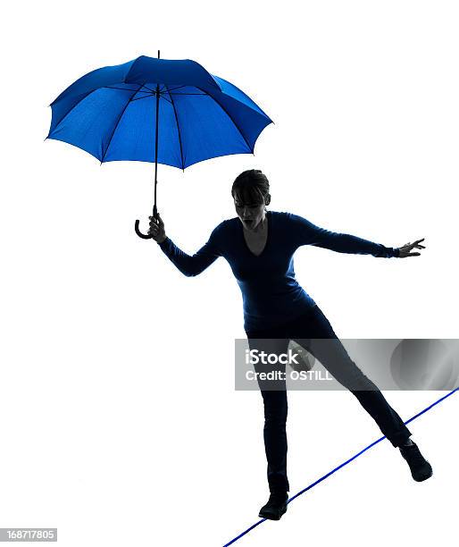 Tightrope Walker Woman Holding Umbrella Silhouette Stock Photo - Download  Image Now - Tightrope Walking, Tightrope, Walking - iStock