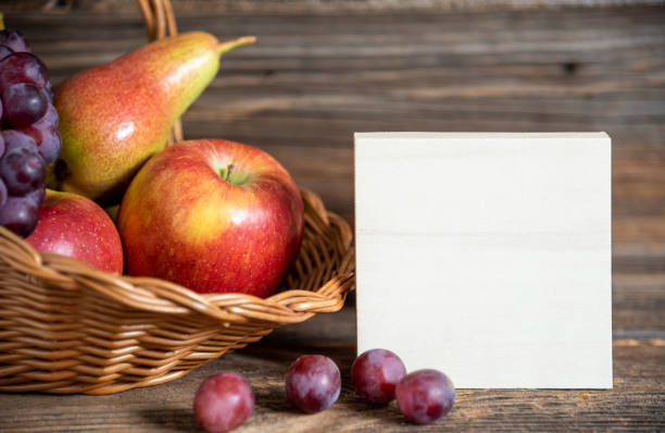 Pears,apples and peaches on wooden table