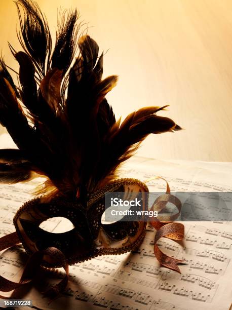 Sheet Music And Masquerade Mask Stock Photo - Download Image Now - Brown, Camouflage, Carnival - Celebration Event