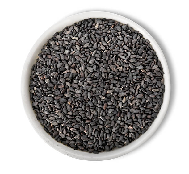 Black sesame in plate isolated stock photo