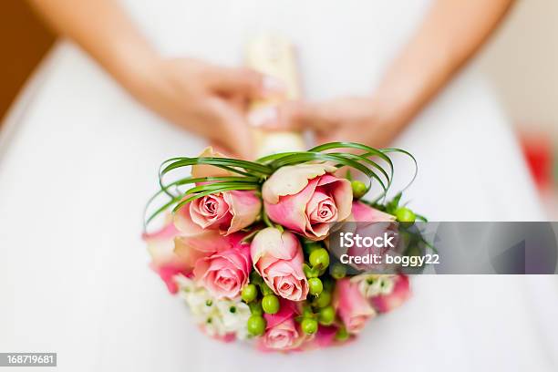 Bride Holding Bouquet Of Pink Flowers Stock Photo - Download Image Now - Bride, Bouquet, Holding