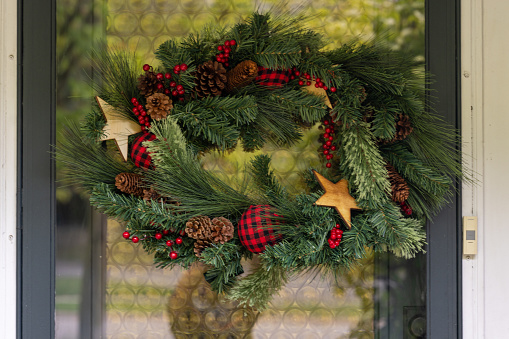 Christmas decorations on a door of a Canadian home