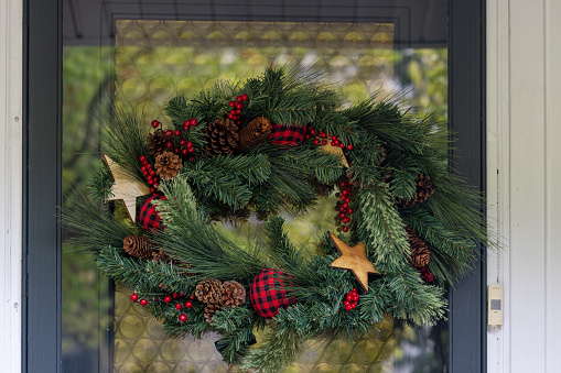 Christmas decorations on a door of a Canadian home