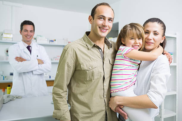 istock Smiling family and a pharmacist 168720337