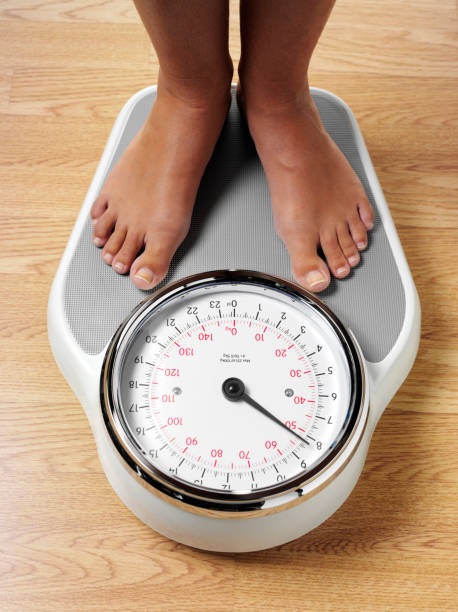 istock Feet on Bathroom Scales 168720557