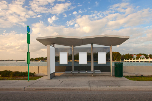 Bus stop station with white blank advertising panels