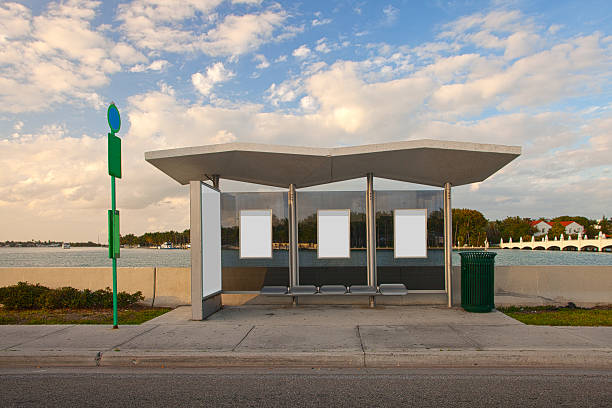 Bus stop station with white blank advertising panels stock photo
