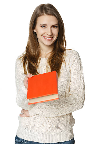 istock Smiling woman giving you a book 168722209