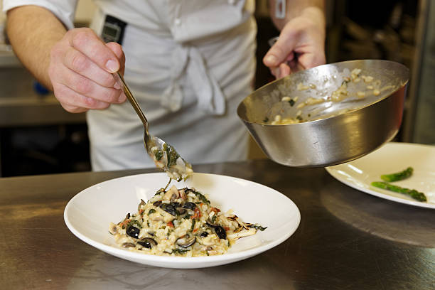 Chef is serving risotto